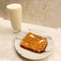 a plate of toast and a glass of milk