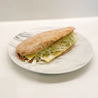 a plate with a sandwich on it