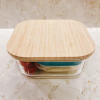 a square bamboo storage container with a lid